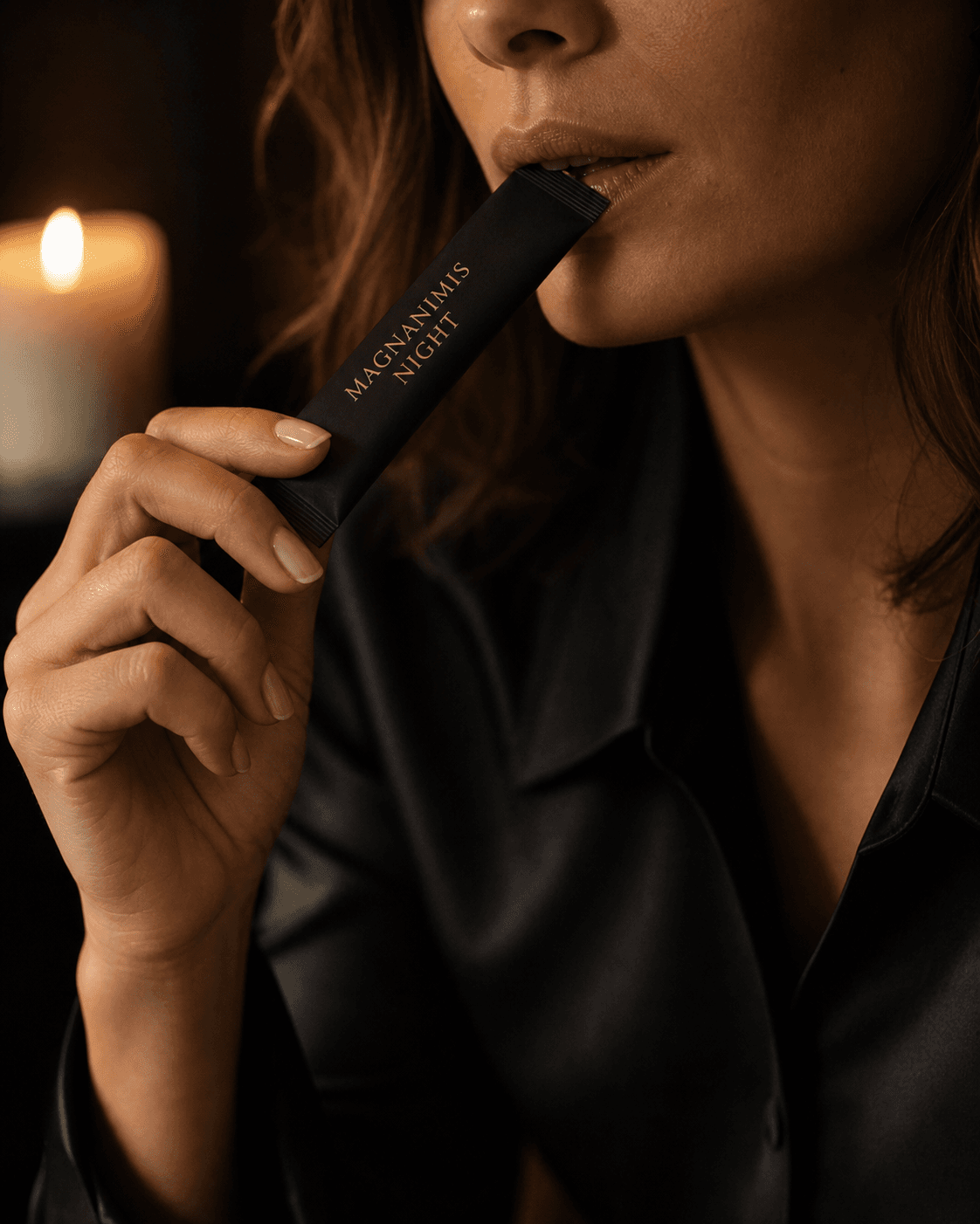 An adult woman enjoying MAGNANIMIS NIGHT directly by candlelight